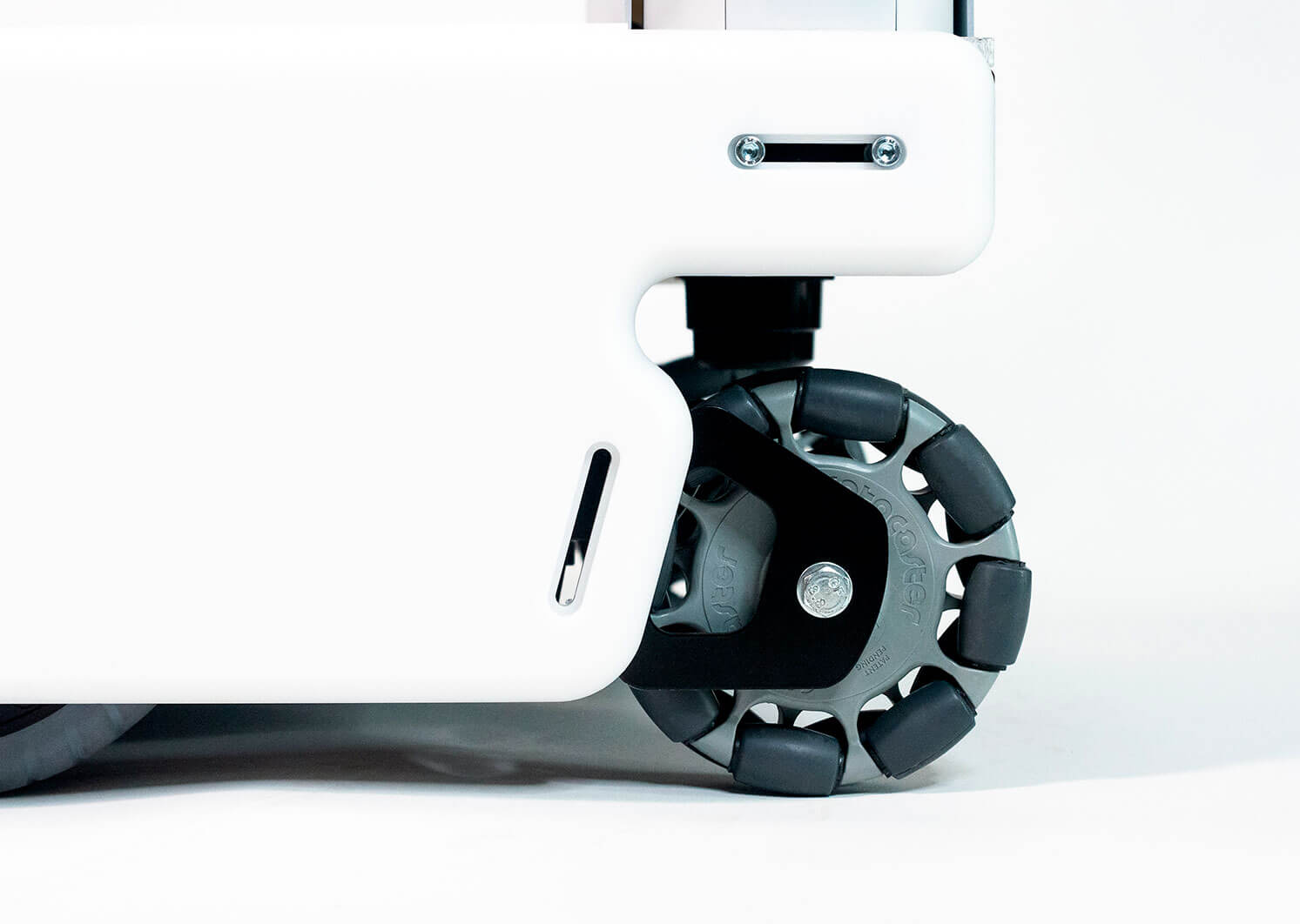 Close-up of a white mobile robot on wheels.