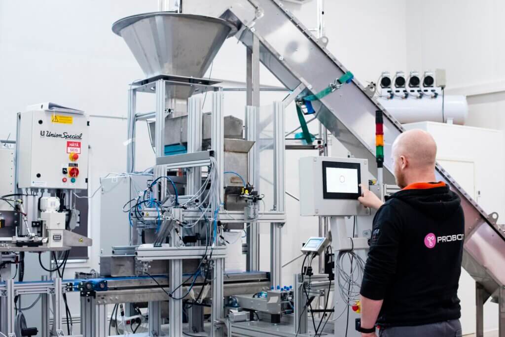 Our engineer Janne Paaso testing the food packaging cell we designed