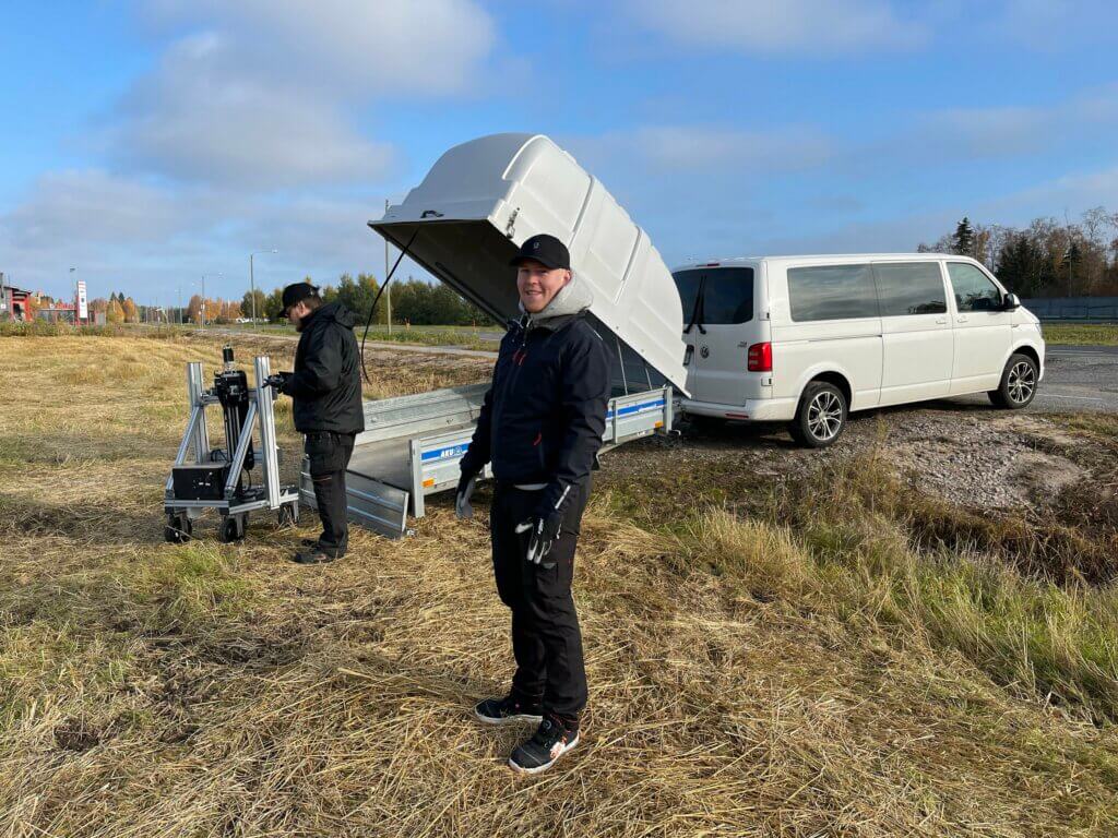 Robotics experts Kari and Ville at the edge of the field ready to test the soil density meter