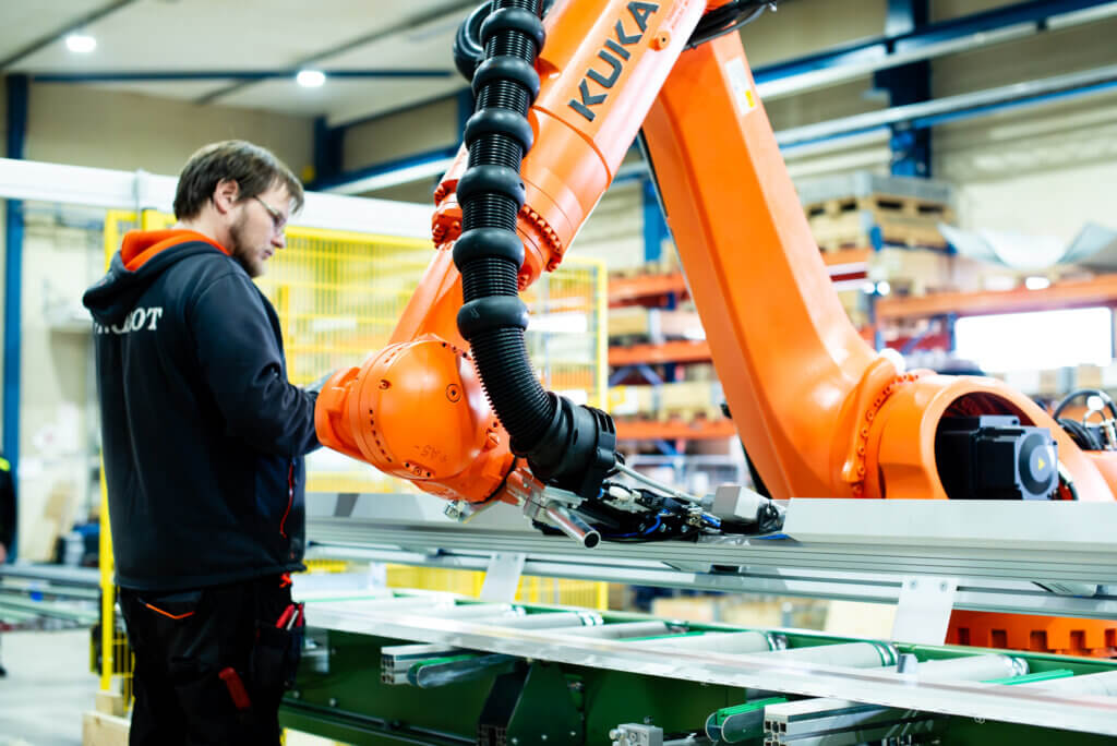 Our robotics expert Kari Anunti programming a robot at our customer's premises.