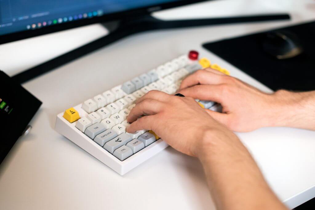 Hands on a keyboard.