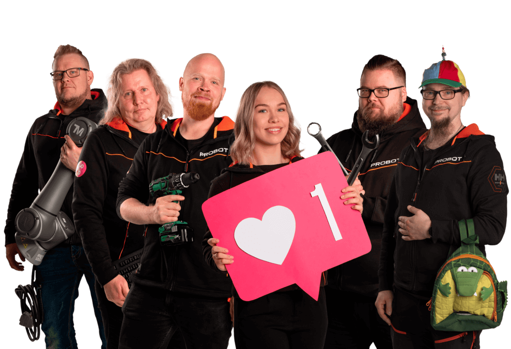 Five smiling employees poses with props.